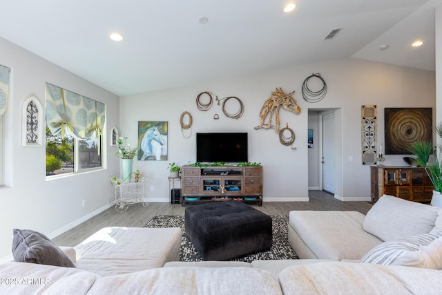 living room with wood-type flooring and vaulted ceiling