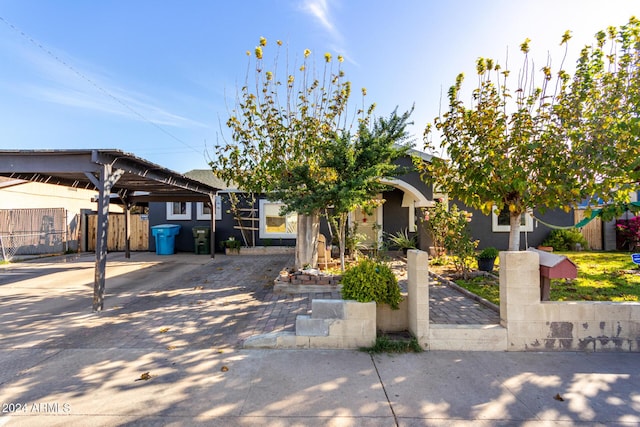 view of front of home with a carport