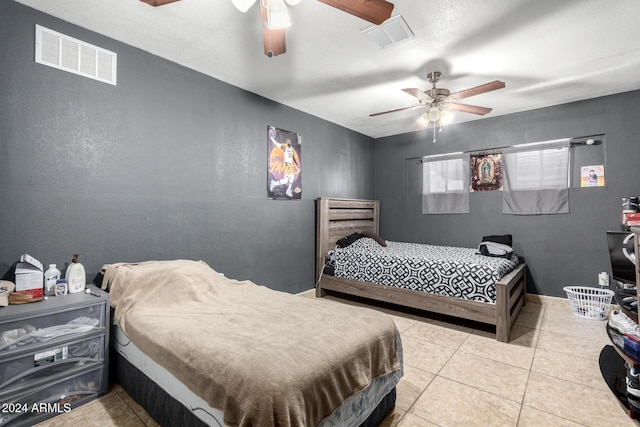 bedroom with light tile patterned floors and ceiling fan