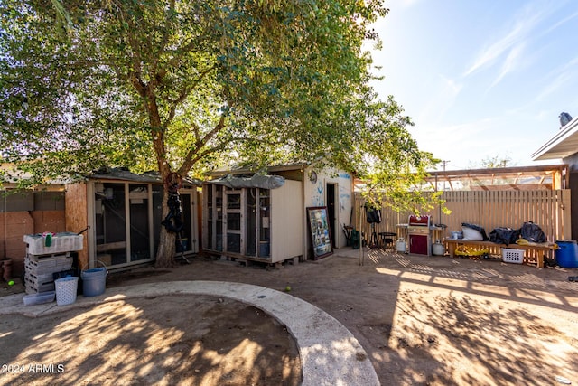 back of property with a patio