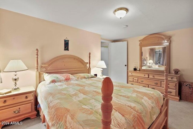 bedroom featuring light colored carpet