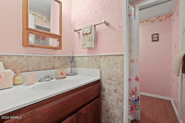 bathroom featuring vanity and wood-type flooring