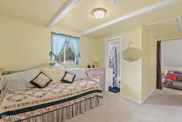 bedroom featuring beamed ceiling and light colored carpet