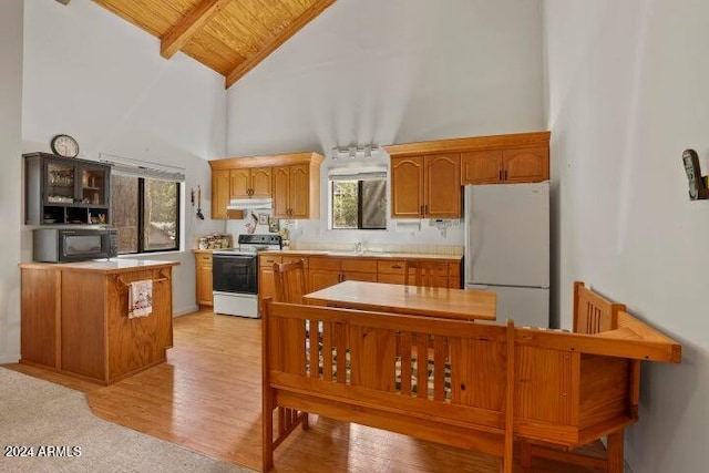 kitchen featuring white appliances, wooden ceiling, high vaulted ceiling, light wood-type flooring, and beamed ceiling