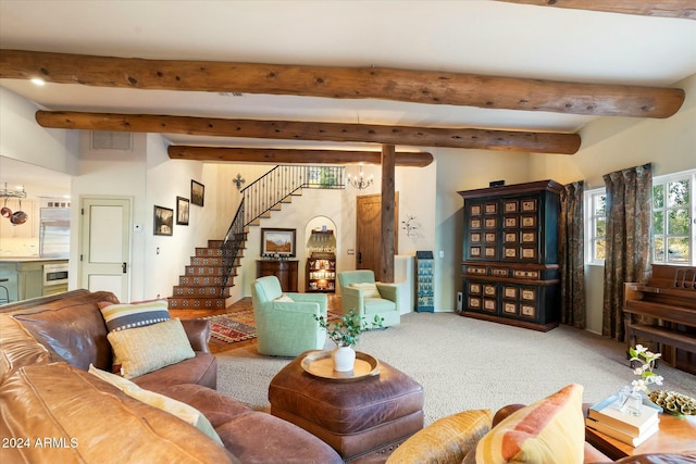 living room featuring beamed ceiling and carpet floors