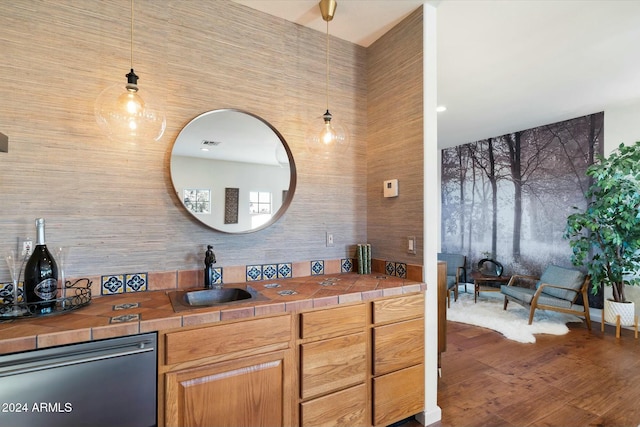 bathroom with hardwood / wood-style flooring and sink