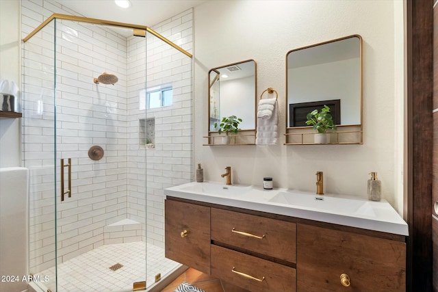 bathroom with vanity and a shower with shower door