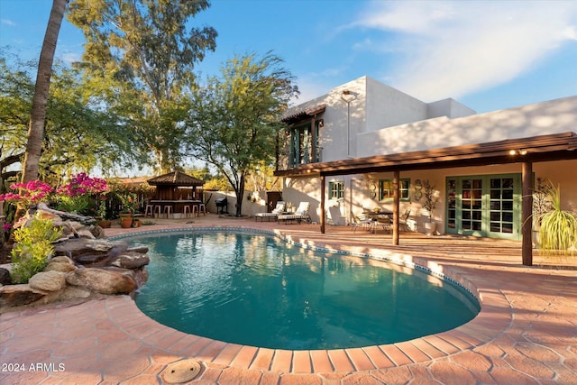 view of pool featuring a patio