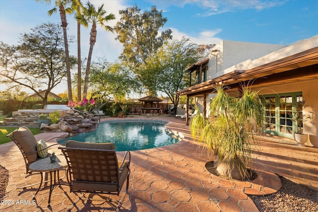 view of swimming pool with a patio