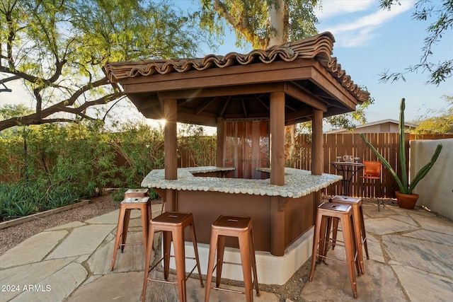 view of patio with an outdoor bar