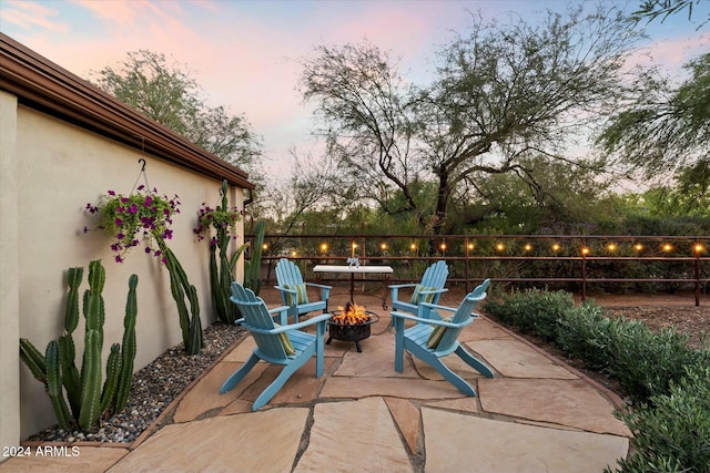 patio terrace at dusk with an outdoor fire pit