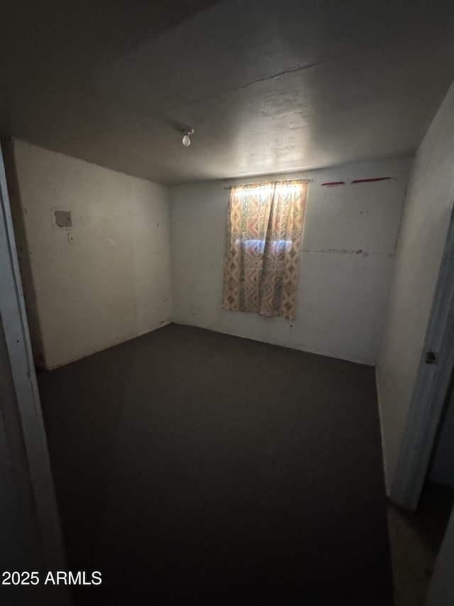 spare room with concrete flooring