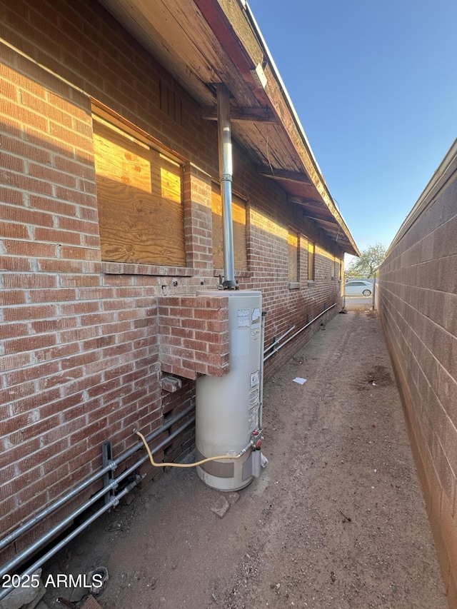 view of home's exterior with water heater