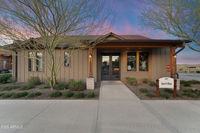 exterior entry at dusk with board and batten siding