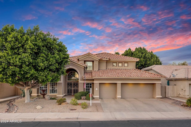 mediterranean / spanish-style home featuring a garage