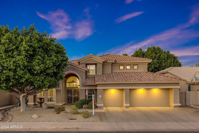 mediterranean / spanish-style home featuring a garage