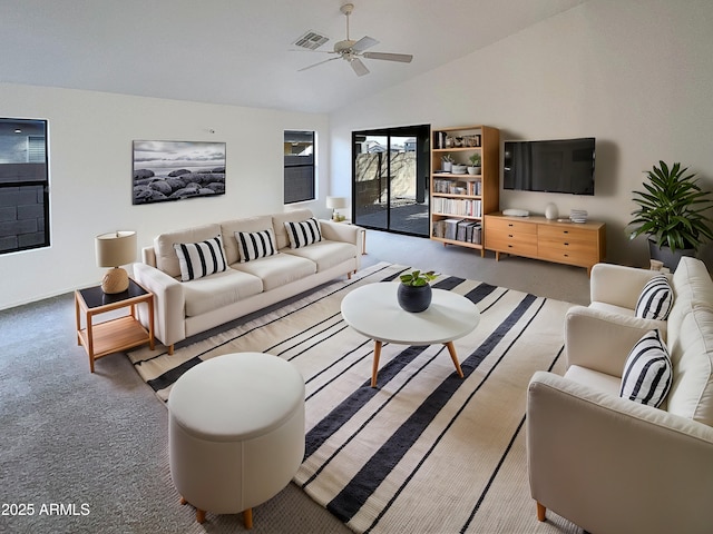 living area featuring ceiling fan, high vaulted ceiling, carpet flooring, and visible vents