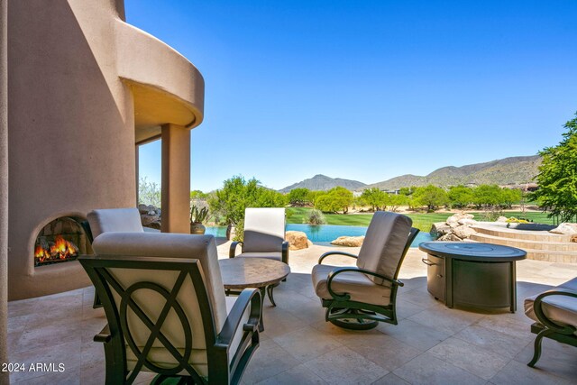 view of patio / terrace with a mountain view