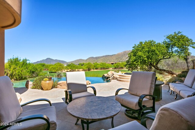 view of patio / terrace with a mountain view