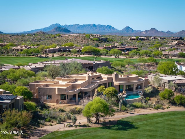 birds eye view of property featuring a mountain view