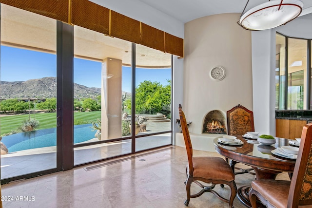 dining room with a mountain view and expansive windows