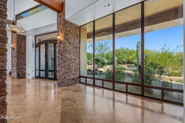 interior space with french doors and plenty of natural light