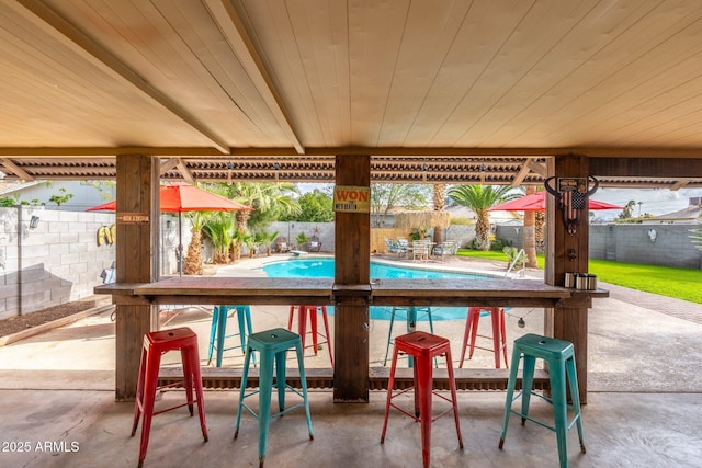 view of patio with a fenced in pool and a fenced backyard