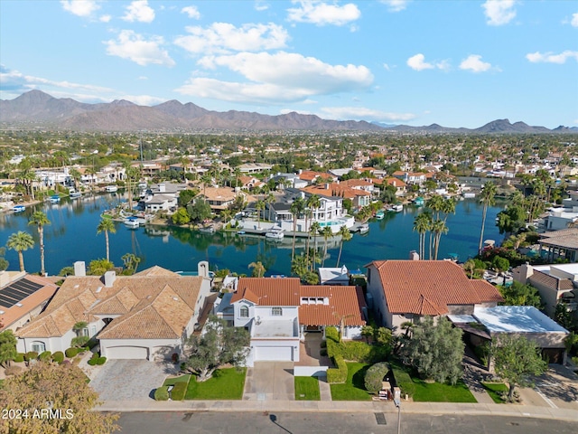 bird's eye view with a water and mountain view