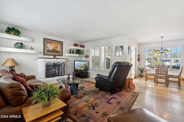 living room featuring a notable chandelier