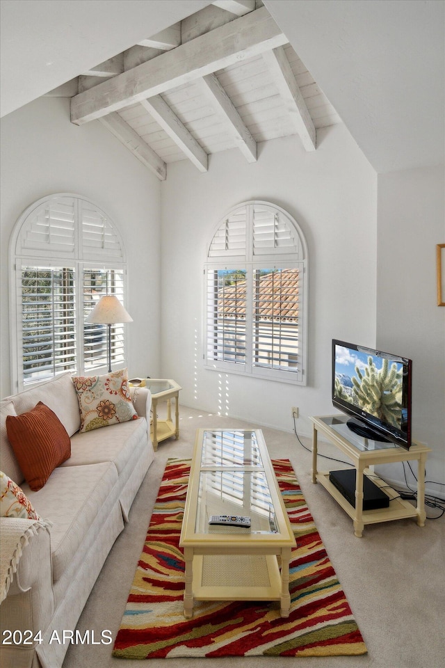 carpeted living room with lofted ceiling with beams, plenty of natural light, and wood ceiling