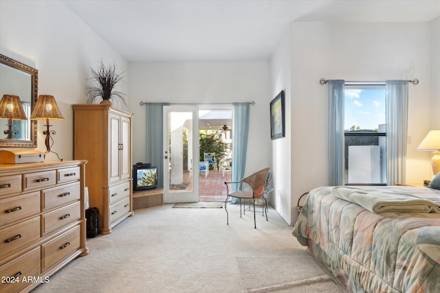 carpeted bedroom with access to outside and french doors