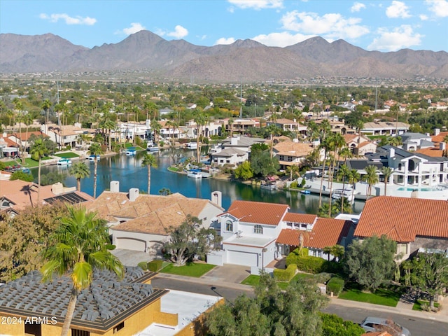 bird's eye view with a water and mountain view