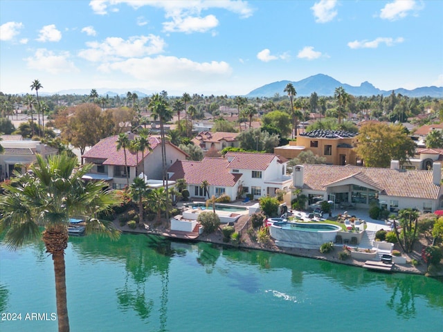 bird's eye view featuring a water and mountain view