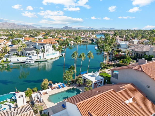 bird's eye view with a water and mountain view