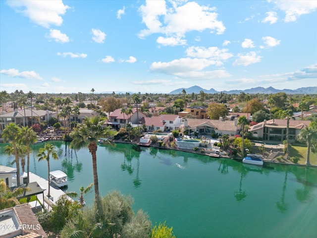 drone / aerial view featuring a water and mountain view