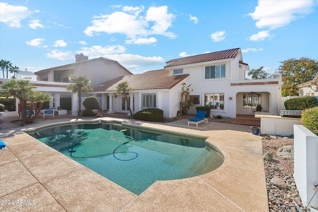 rear view of house featuring a patio area