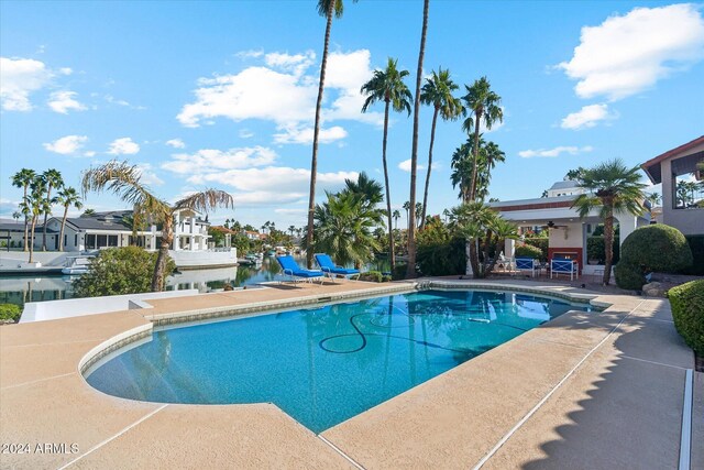 view of pool featuring a patio and ceiling fan