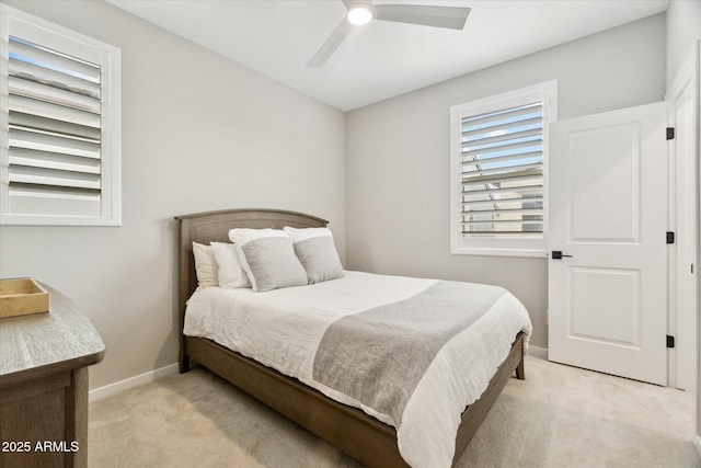 bedroom featuring ceiling fan and light colored carpet