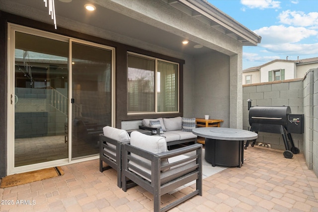 view of patio featuring a grill and an outdoor hangout area