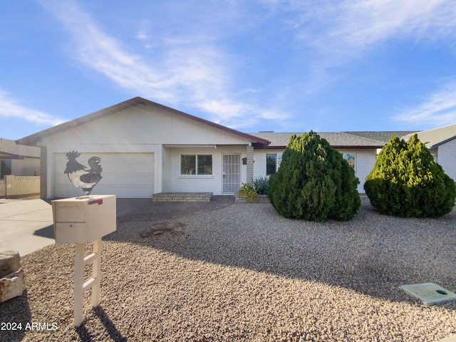 single story home featuring a garage