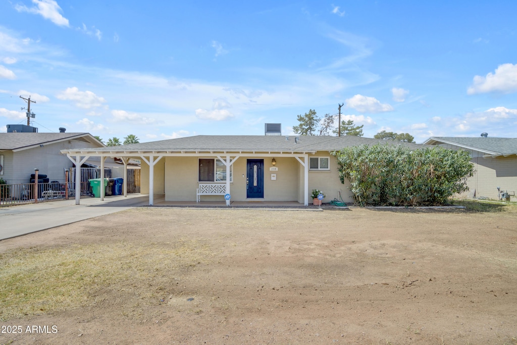 1719 E Dana Ave, Mesa, AZ 85204 - ranch-style house featuring concrete driveway, covered porch, stucco siding, and a carport