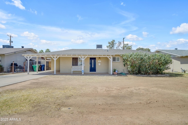 1719 E Dana Ave, Mesa, AZ 85204 - ranch-style house featuring concrete driveway, covered porch, stucco siding, and a carport