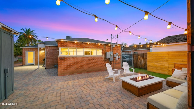 patio terrace at dusk with a fire pit