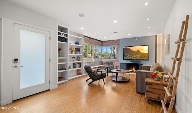 sitting room with light hardwood / wood-style flooring