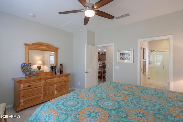 bedroom featuring ceiling fan and ensuite bath