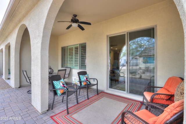 view of patio featuring ceiling fan