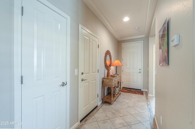 corridor with light tile patterned flooring