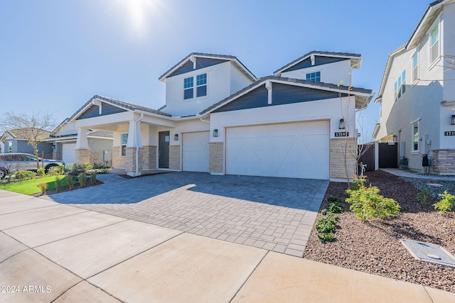 craftsman house featuring a garage and central air condition unit