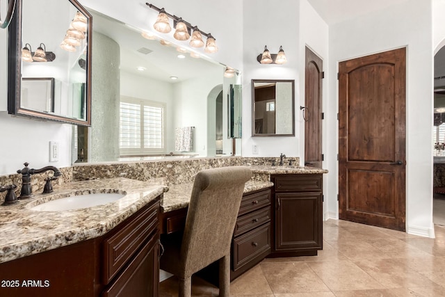 bathroom with tile patterned flooring and vanity