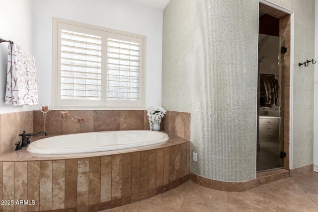 bathroom featuring tile patterned floors and independent shower and bath